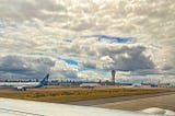 Planes lined up on the runway at Seattle-Tacoma Airport.