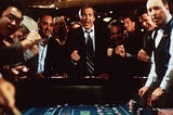 casino-goers yelling around a craps table