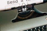 typewriter with type written sheet: ‘send a mail’