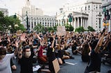 Crowd of people, predominantly White, participating in a Black Lives Matter Protest