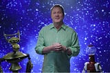Screenshot of Michael J. Nelson and the Crow T. Robot and Tom Servo puppets against a starry-sky backgroup.