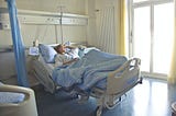 Patient in hospital bed