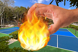 Image of pickleball on fire being dropped