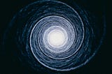 Abstract circular light pattern converging toward a bright centre, symbolising reinforcing loops and intentional direction.