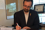 David Donofrio writing in an office