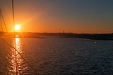 Sunset cityscape from a sailboat