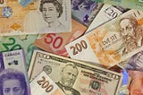 The Pros and Cons of a Single World Wide Currency and Local Rural Currencies