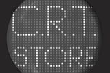 Rounded screen showing “C.R.T. STORE” on a 32x32 grid of pixels.