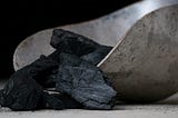 Coal scuttle with coals