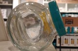 A glass container resting on its flat surface