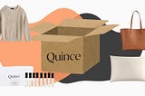 A box of Quince items with a fisherman sweater, a brown leather tote bag, a perfume sampler set, and a silk pillowcase.