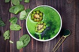 Green Smoothies made with spinach, spirulina, almond milk and kiwi