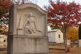 A fall scene of the angelic grave of Mary Glover Thurman.
