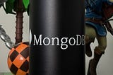 Zoomed-in shot of a MongoDB Camelbak water bottle, flanked on the left by a Dr. Robotnik figure and on the right by a Link figure from Breath of the Wild.