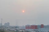 a hazy sun photographed from a window