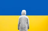 A person facing the Ukrainian flag