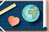 A globe and a heart on a blueprint