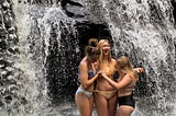 Three 17-year-olds hold each other up on the slippery rocks of Garwin Falls in Wilton, NH.