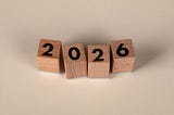 Wooden blocks in a row displaying 2026