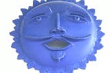 A ceramic blue sun with a face.