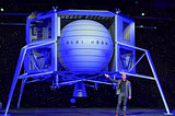 Blue Moon, lunar lander replica, at the Washington Convention Center, with Jeff Bezos standing in front of it