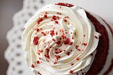 red velvet cake, dessert, close-up of whipped cream and red crumble, on a plate | © pockett dessert, red velvet cake