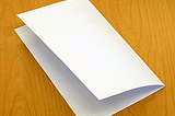 A blank sheet of paper folded in half