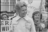 Phyllis Schlafly, wearing a “Stop ERA” badge