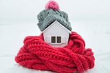 Insulated home wrapped in hat and scarf