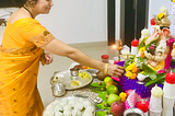 Author’s Image. Placing a flower at the feet of Ganesha’s idol