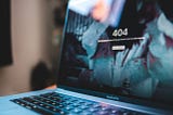 Image of laptop screen with 404 webpage error meaning the page does not exist.