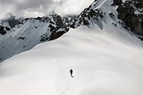 Man running in a wide snow mountain