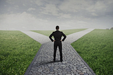 man at the crossroads making decisions