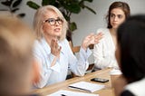 A professor mentors her students.