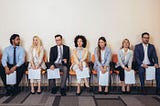 Group of business professionals waiting for their interview.
