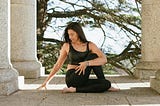 Attractive woman doing outdoor yoga.