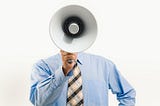 A photo of a man holding a megaphone