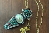 Navajo turquoise watchband and gold chain with ornament