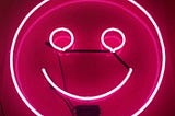 pink neon smiley face