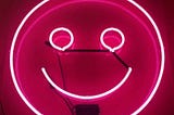 pink neon smiley face