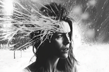Grayscale illustration of a confused woman with a furrowed brow and with spikes of frost emanating from her forehead