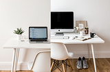 A split image comparing two work-from-home setups. The left side is a sterile, perfect, minimalist desk. The right side is a realistic, messy desk with coffee, notes, and running shoes, showing the reality of building habits in a real life.