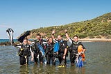 Scuba students in shallow waters