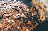 A spilled jar full of pennies