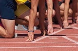 Sprinters lined up on the starting blocks, ready to race!