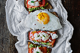 avocado toast with goat cheese and tomato.