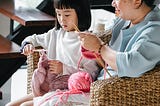 Mother and daughter knitting