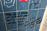 Graffiti/ scribblings on the wall of a public bathroom