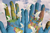 world peace — globe hands and white doves