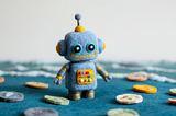 A felt toy robot counting tokens